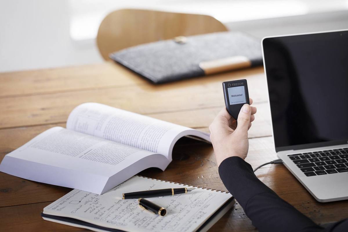 trezor t being used by woman at computers