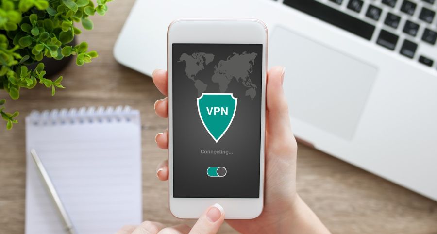 man holding smartphone with vpn running