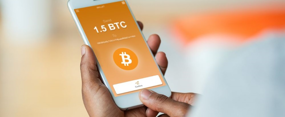 person sending btc on mobile phone